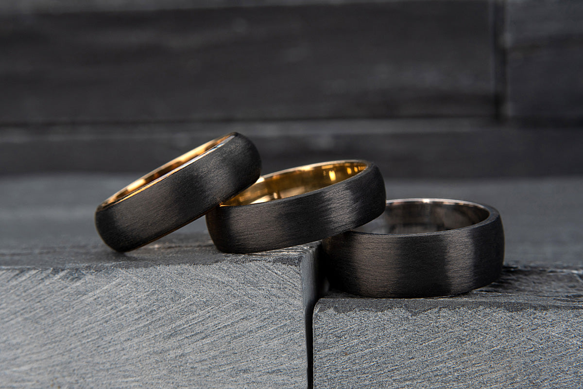 Carbon Fibre and Gold Rings