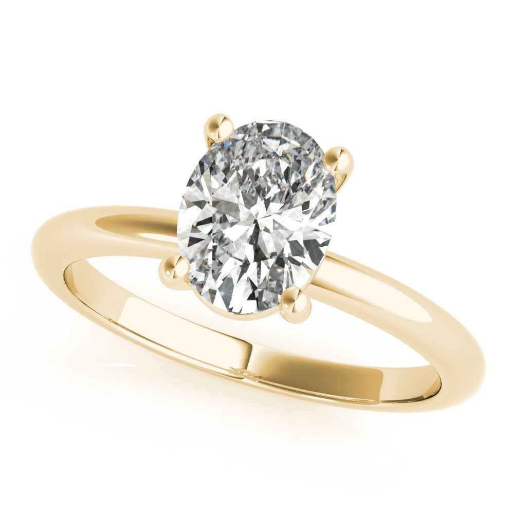 An oval diamond engagement ring setting in a yellow gold band