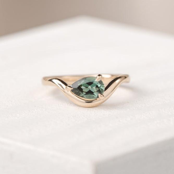 Dahlia Curved East West 0.98 ct Green Teal Australian Sapphire Engagement Ring